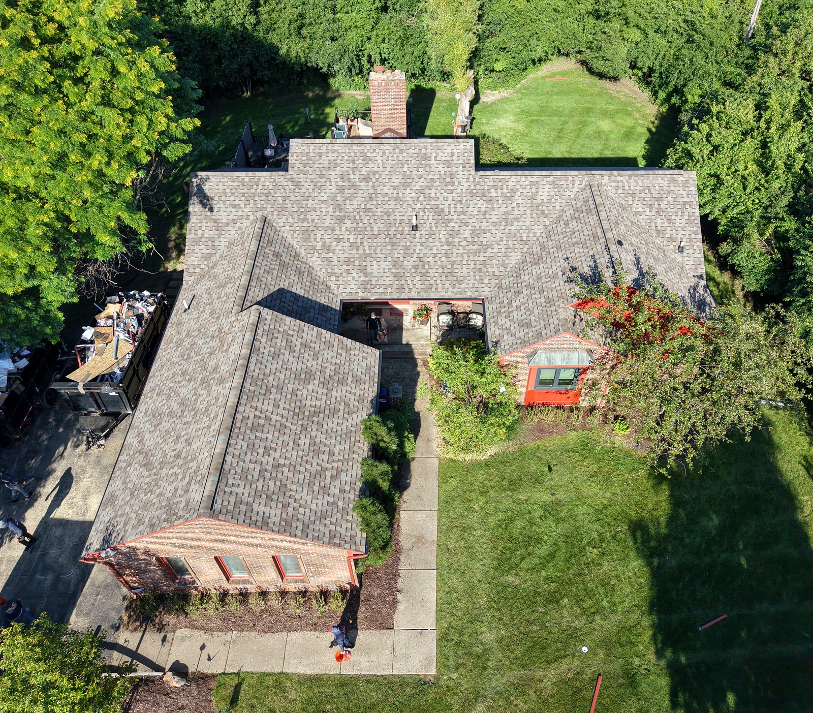 Get-R-Done Roofing aerial drone view of completed project in Oakland County, Michigan — full roof, gutters, and siding replacement