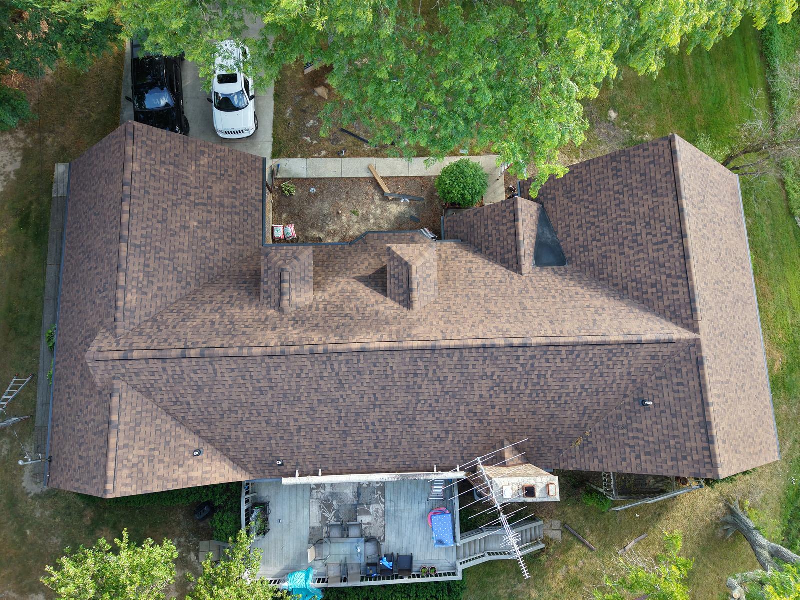 Get-R-Done Roofing completed project in Flushing, Michigan — overhead drone view of full roof replacement with new architectural shingles and gutters